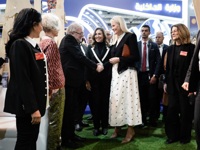 Jostein Gaarder, seen here greeting Crown Princess Mette-Marit, is one of the 17 Norwegian authors who will be participating at events at the book fair. Photo: Cornelius Poppe, NTB